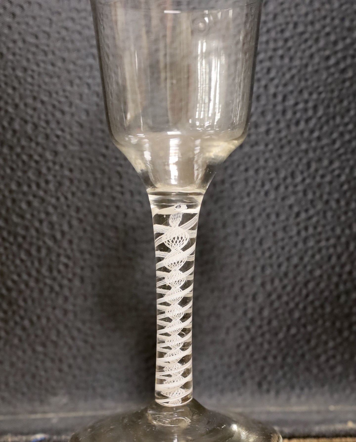 An 18th century double series opaque twist stem wine glass, 16cm tall
